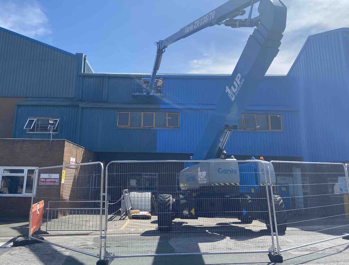 Transform Industrial Buildings with Cherry Picker Painting