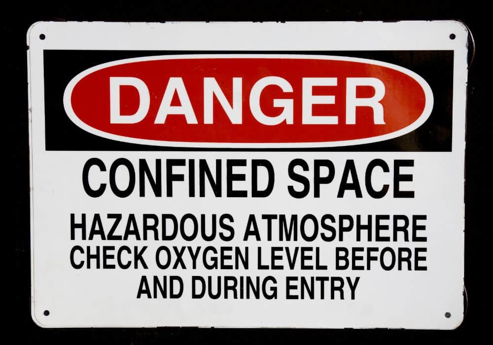 danger sign for confined space cleaning: sign reads "Danger confined space, hazardous atmosphere, check oxygen level before and during entry"